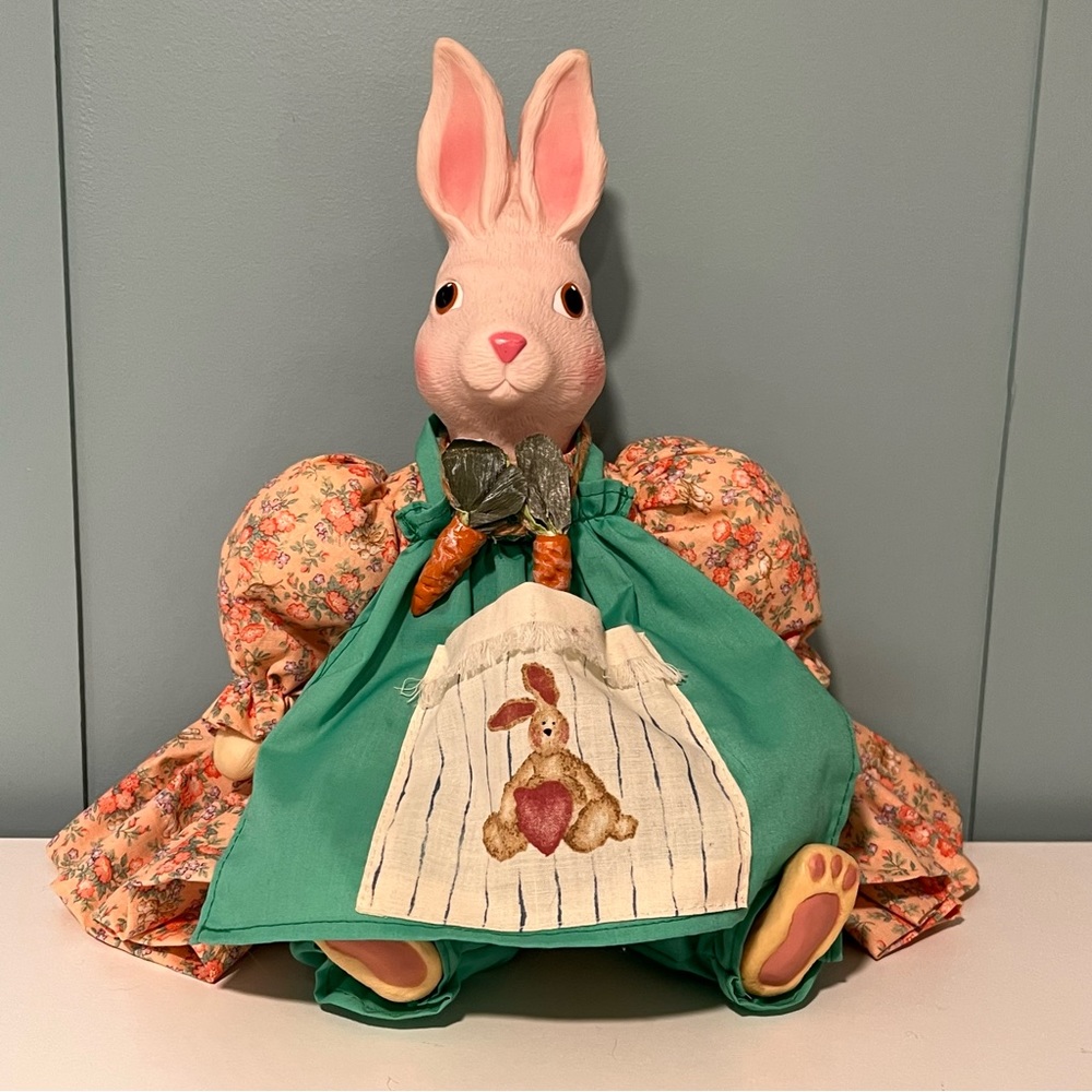 Bunny Dressed‎ in Her Apron, Carrot Necklace, Peach Dress & Green Pantaloons.